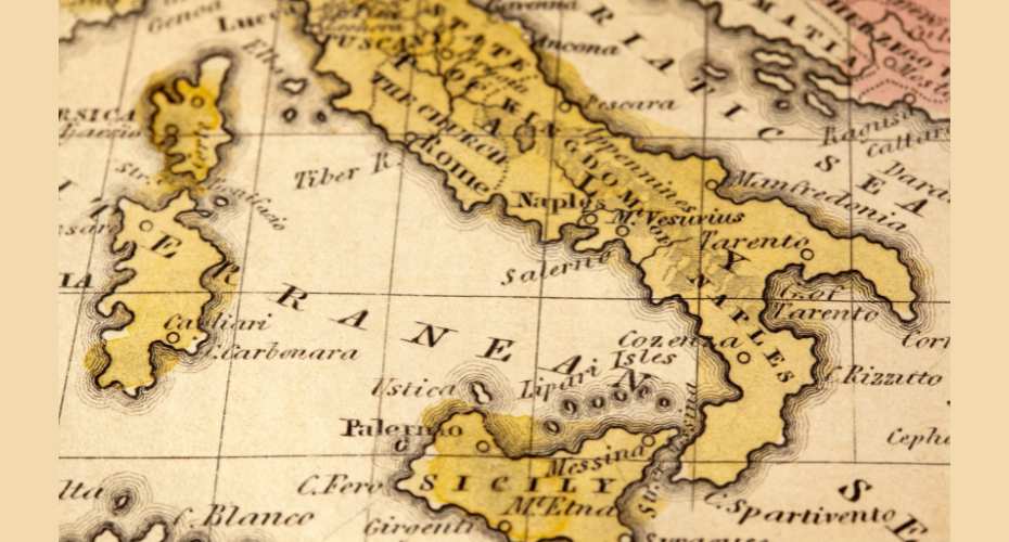 Hitoric map of Italy painted in cream and beige with aspects of the map labelled in black