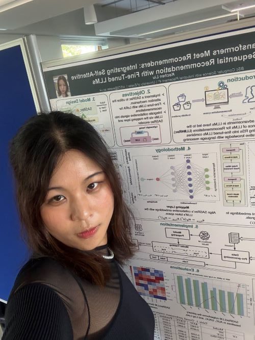 Student selfie in front of a computer science poster